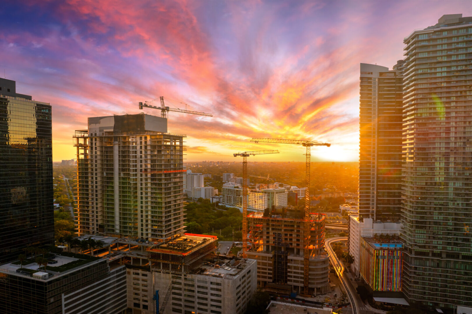 Miami, Florida. Developing American megapolis with new high-rise buildings under construction at sunset