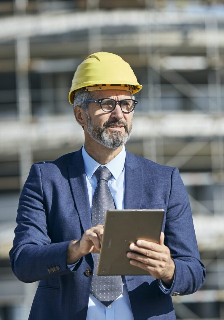 businessman construction site business architect building engineer builder tablet helmet architecture blueprint worker man contractor adult engineering industry